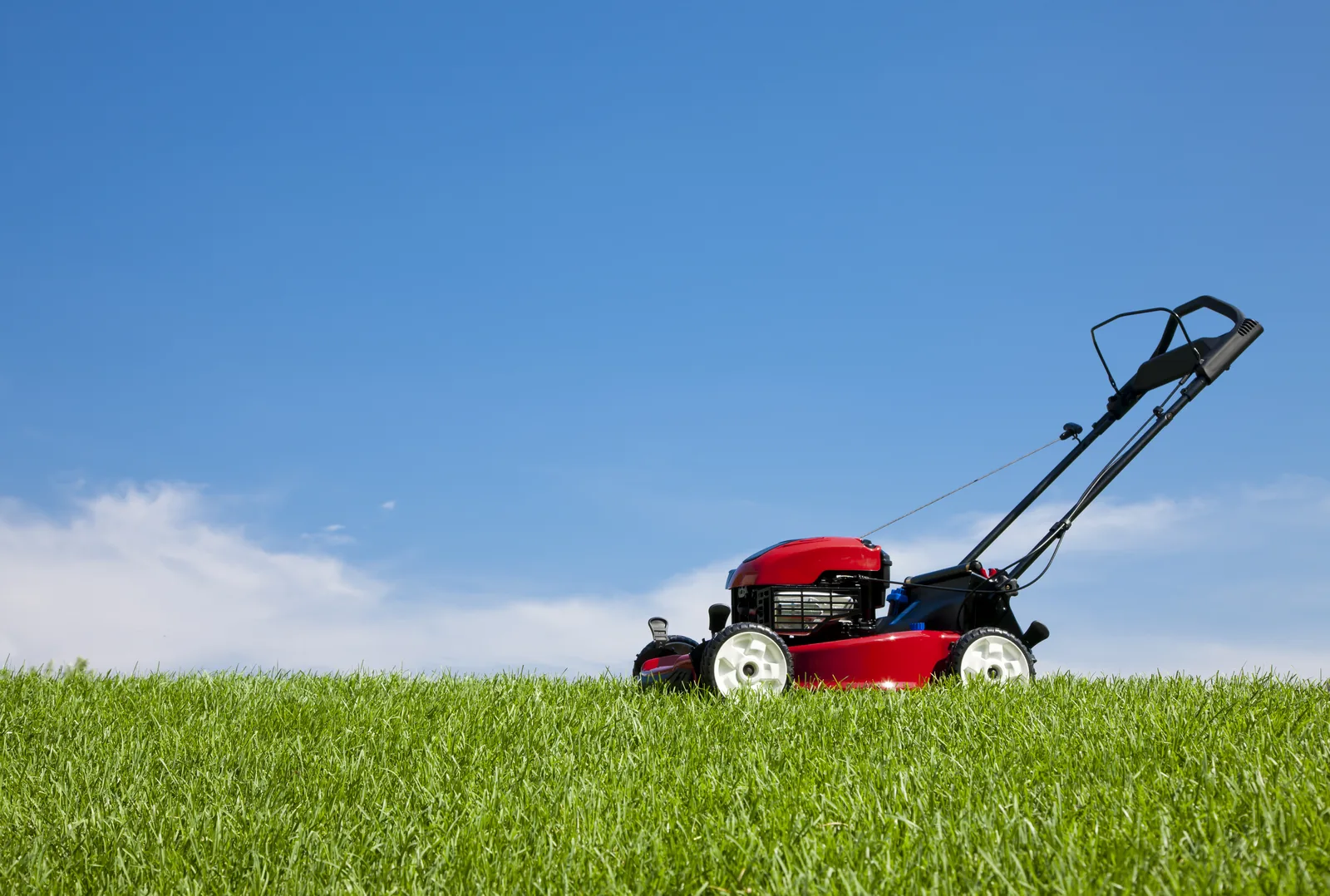 Grounds maintenance under way on a large lawn